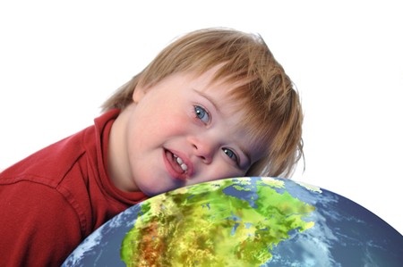 Boy with down syndrome and earth isolated on white