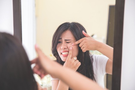 Woman Breaking Acne